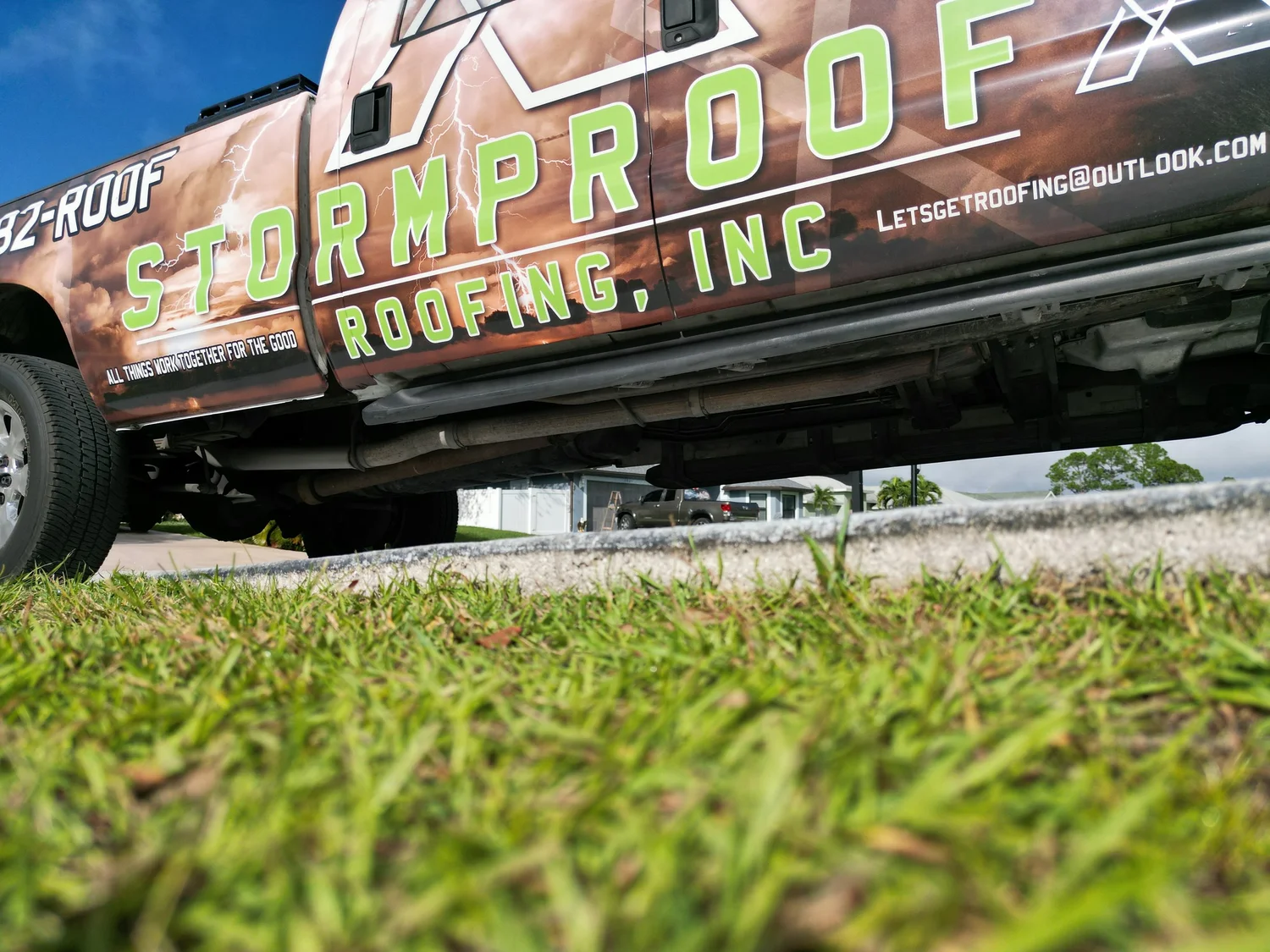 Stormproof Roofing, Inc branded roofing truck