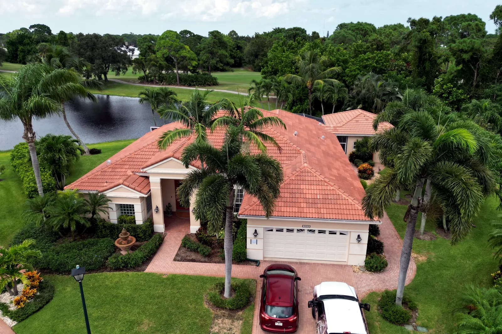 Aerial roof inspection view of tile roof home by Stormproof Roofing, Inc